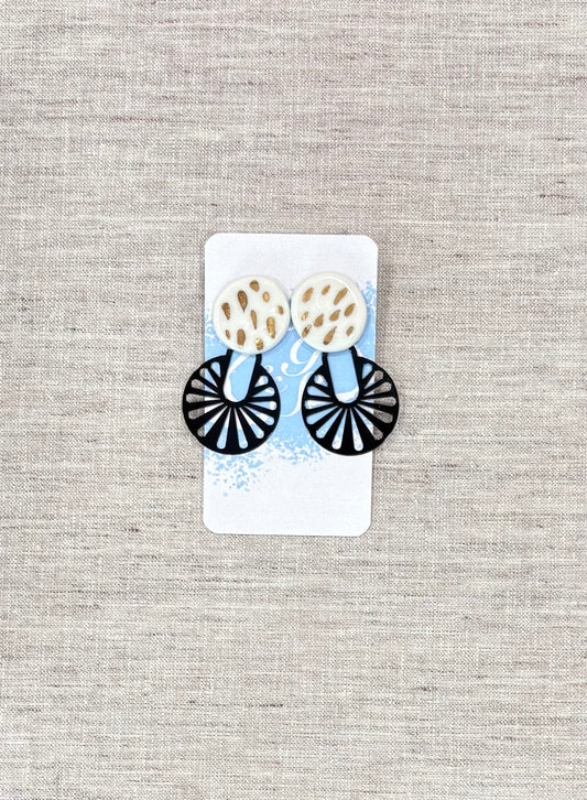 Black, white, and gold dangling earrings